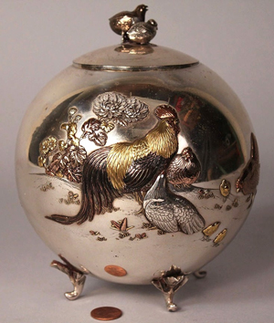 This rooster-decorated Japanese silver tea caddy soared to $32,220. Image courtesy Case Antiques.
